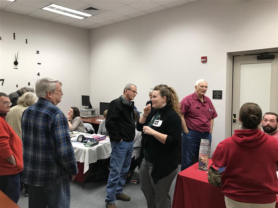 A consumer event with people in conversation.